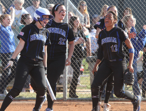 Rick Egan  | The Salt Lake Tribune 

Bingham players celebrate Chelsea Latu's (21) game winning two-run homer in the 7th inning for Bingham, in prep softball action, Bingham vs Riverton, Wednesday, April 3, 2013.