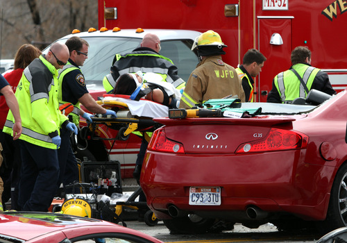 Rick Egan  | The Salt Lake Tribune
A woman was injured, possibly critically, on Friday making a left-hand turn onto Redwood Road in West Jordan. Shortly before noon, the woman turned to go north onto Redwood Road (1700 West) from 7600 South when a southbound vehicle crashed into  her, said West Jordan Police Sgt. Dan Roberts. Details of the crash remained scarce Friday afternoon, but the woman was flown to Intermountain Medical Center with possibly critical injuries, while the driver of the second vehicle was taken in ambulance to another hospital, Roberts said.