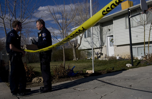 Kim Raff  |  The Salt Lake Tribune
American Fork police and forensics experts investigate the scene Friday where a 5-month-old boy was shot to death at 582 N 500 East in American Fork on April 5, 2013.
