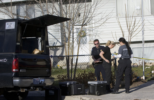 Kim Raff  |  The Salt Lake Tribune
American Fork police and forensics experts investigate the scene Friday where a 5-month-old boy was shot to death at 582 N 500 East in American Fork on April 5, 2013.