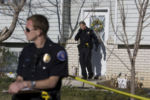 Kim Raff  |  The Salt Lake Tribune
American Fork police and forensics experts investigate the scene Friday where a 5-month-old boy was shot to death at 582 N 500 East in American Fork.
