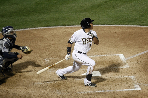 Chris Detrick  |  The Salt Lake Tribune
Salt Lake Bees' Efren Navarro (16) hits a three-run RBI in the bottom of the seventh inning during the game at Spring Mobile Ballpark Thursday April 4, 2013. ]