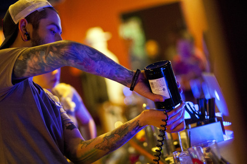 Chris Detrick  |  The Salt Lake Tribune
Bartender Levi Montoya pours a shot at Campfire Lounge (837 E 2100 S) in Sugarhouse Thursday March 28, 2013.