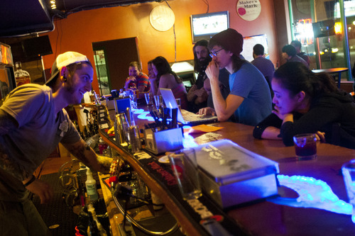 Chris Detrick  |  The Salt Lake Tribune
Bartender Levi Montoya talks with owner Haylen Latorre at Campfire Lounge (837 E 2100 S) in Sugarhouse Thursday March 28, 2013.