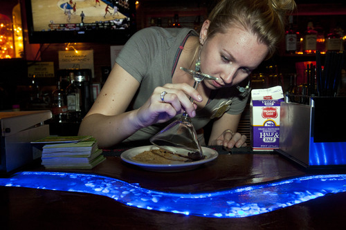 Chris Detrick  |  The Salt Lake Tribune
Bartender Chris Pavel rims the glass in chocolate and graham cracker mix for a S'mores-tini at Campfire Lounge (837 E 2100 S) in Sugarhouse  Thursday March 28, 2013.