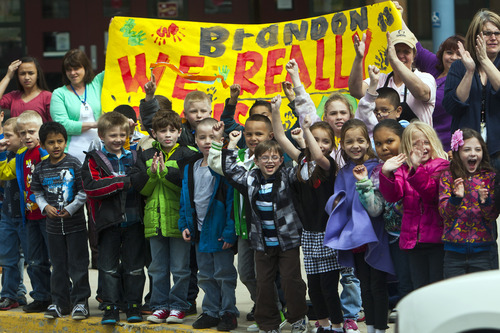 Chris Detrick  |  The Salt Lake Tribune
Fellow students hold signs and cheer for Brandon Royo, 9, at Whittier Elementary in West Valley City. Royo, a second grade student at Whittier Elementary, is dying from medulloblastoma, a form of brain cancer.