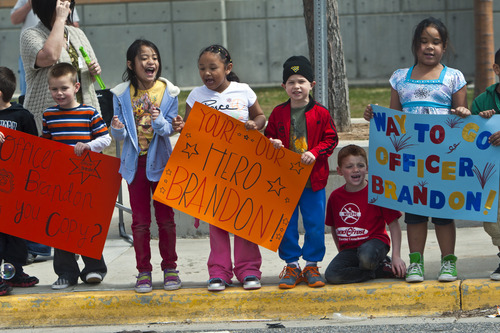 Chris Detrick  |  The Salt Lake Tribune
Fellow students hold signs and cheer for Brandon Royo, 9, at Whittier Elementary in West Valley City Tuesday March 26, 2013. Royo, a second grade student at Whittier Elementary, is dying from medulloblastoma, a form of brain cancer.