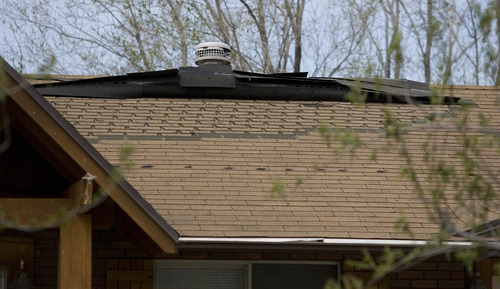 Paul Fraughton  |  The Salt Lake Tribune
Shingles blown off roofs were a common sight in the Centerville and Farmington areas after strong winds struck Davis County Monday night and Tuesday morning.