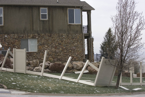 Paul Fraughton  |  The Salt Lake Tribune
Strong winds Monday and Tuesday destroyed the vinyl fence around a Centerville home.