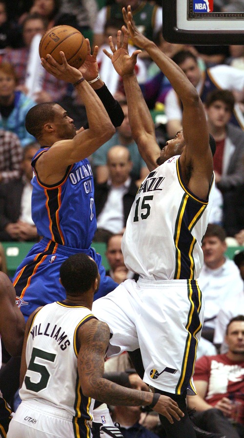 Leah Hogsten  |  The Salt Lake Tribune
Utah Jazz power forward Derrick Favors (15) goes up with Oklahoma City Thunder point guard Russell Westbrook (0). Oklahoma City Thunder defeated the Utah Jazz 90-80 April 9, 2013, at Energy Solutions Arena in Salt Lake City,
