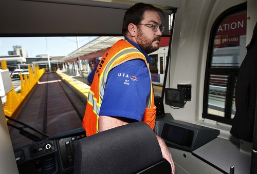Leah Hogsten  |  The Salt Lake Tribune
TRAX operator Seth Thompson steps off the new line to Salt Lake CIty International Airport on Wednesday, April 10, 2013. The six-mile line takes about 20 minutes to travel from downtown Salt Lake City to the airport as part of the green line from West Valley City. Trains will run every 15 minutes on weekdays, and every 20 minutes on weekends.
