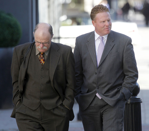 Al Hartmann  |  The Salt Lake Tribune
Jeremy Johnson, leaving court with defense lawyer Ron Yengich earlier month, said Monday he could not comment on the latest ruling because he is under a court order not to discuss the criminal case. "I'd love to comment but I am gagged," Johnson wrote in a text message. "No First Amendment for me."