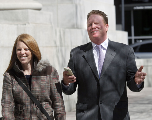 Al Hartmann  |  The Salt Lake Tribune
Jeremy Johnson and wife Sharla smile and say that they can't say anything to the media after leaving Federal Court in Salt Lake City Wendesday April 10, 2013, for his initial appearance on an indictment on conspiracy, fraud and money laundering in connection to his I Works company.
