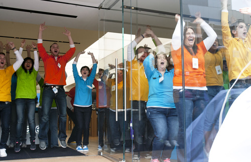 Steve Griffin | The Salt Lake Tribune

Microsoft Store employees scream and jump up and down from inside the company's first store in Utah as a drape covering the store falls to the ground during grand opening at the City Creek Center in Salt Lake City, Utah Thursday April 11, 2013.