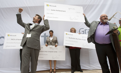 Steve Griffin | The Salt Lake Tribune

Microsoft's Kevin Eagan, right, gives Phil Cofield of Junior Achievement of Utah, a check for 1 million dollars during grand opening of the Microsoft Store at the City Creek Center in Salt Lake City, Utah Thursday April 11, 2013. Microsoft gave money to several other local partners during the event.