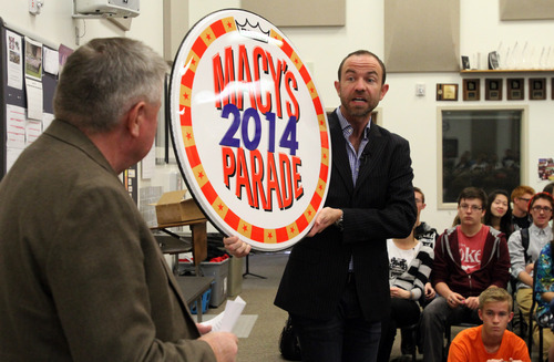 Rick Egan  |  The Salt Lake Tribune
Wesley Whatley, right, creative director of Macy's Thanksgiving Day Parade and head of the parade's band selection committee, presents the Macy's 2014 drum head to American Fork band director, John Miller on Thursday as part of the invitation to perform in the 2014 parade.