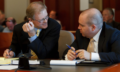 Trent Nelson  |  The Salt Lake Tribune
Attorneys Jeffrey Shields and Michael Stanger confer during a court hearing on the polygamous UEP land trust, Friday April 12, 2013 in Salt Lake City.