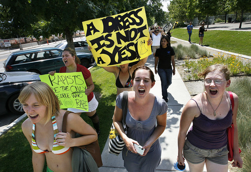 Scott Sommerdorf  |  The Salt Lake Tribune
The annual SlutWalk will be Saturday, April 13, at the City-County Building in Salt Lake City. In this photo from the 2011 walk, Hatley Leffridge, Eric Carr and Roxanne Briggs hold signs and chant slogans. The event is designed to raise awareness of sexual assault and to deter blaming or shaming the victim.
