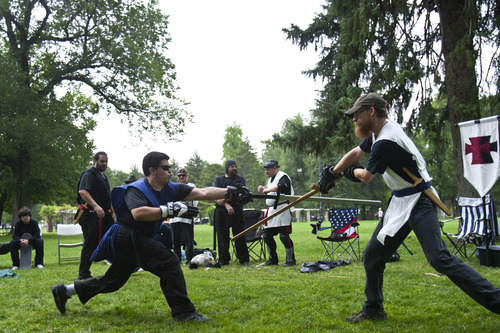 Chris Detrick  |  The Salt Lake Tribune
The United Clans Swordsman Association will hold its first sword fighting competition of the year April 13, 2013, in Liberty Park in Salt Lake City. In this photo from a 2012 event, Jack Stewart, left, and Zeb Bjorge compete.