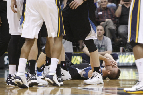 Chris Detrick  |  The Salt Lake Tribune
Minnesota Timberwolves point guard J.J. Barea (11) remains on the ground after being fouled by Utah Jazz power forward Derrick Favors (15) during the second half of the game at EnergySolutions Arena Friday April 12, 2013. The Jazz won the game 107-100.