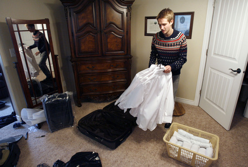 Francisco Kjolseth  |  The Salt Lake Tribune
Brennan Rasmussen, 18, of Provo packs his things on Tuesday, April 9, 2013, as he gets ready to leave for the MTC on Wednesday and then off to Baltimore for his mission. Rasmussen graduated from Timpview High early in order to go on his mission when he turned 18.