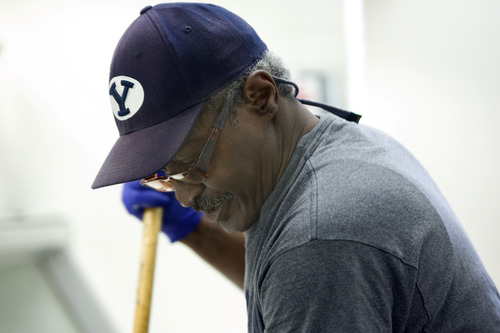 Kim Raff  |  The Salt Lake Tribune
Army veteran Gilbert Williams sweeps the serving area of the canteen in the George E. Wahlen Department of Veterans Affairs Medical Center in Salt Lake City on April 12, 2013. "I take a lot of pride in my work," says Williams. Williams lost his job of 14 years when Hostess closed last fall.
