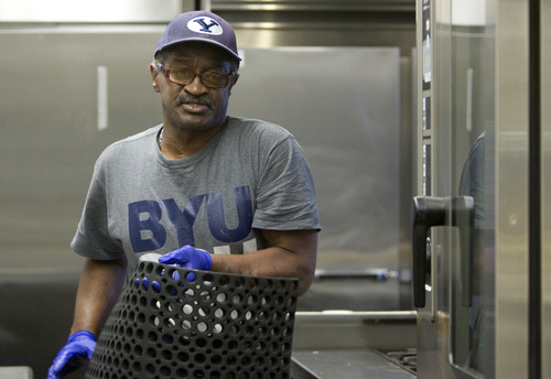 Kim Raff  |  The Salt Lake Tribune
Gilbert Williams, an Army veteran, carries floors mats to clean in the kitchen of the canteen in the George E. Wahlen Department of Veterans Affairs Medical Center in Salt Lake City on April 12, 2013. "I take a lot of pride in my work," says Williams. Williams lost his job of 14 years when Hostess closed last fall, but didn't want to coast on unemployment. By January, he had three job offers and took a housekeeping aide job at the medical center.