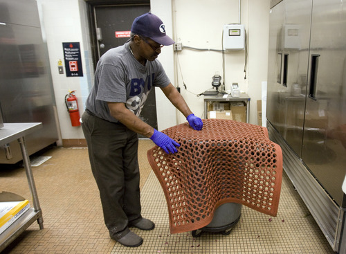 Kim Raff  |  The Salt Lake Tribune
Gilbert Williams, an Army veteran, cleans a floor mat in the kitchen of the canteen in the George E. Wahlen Department of Veterans Affairs Medical Center in Salt Lake City on April 12, 2013.