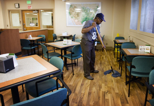 Kim Raff  |  The Salt Lake Tribune
Gilbert Williams, an Army veteran, mops the dining room of the canteen in the George E. Wahlen Department of Veterans Affairs Medical Center in Salt Lake City on April 12, 2013. Williams lost his job of 14 years when Hostess closed last fall but didn't want to coast on unemployment. By January, he had three job offers and took a housekeeping aide job at the medical center.