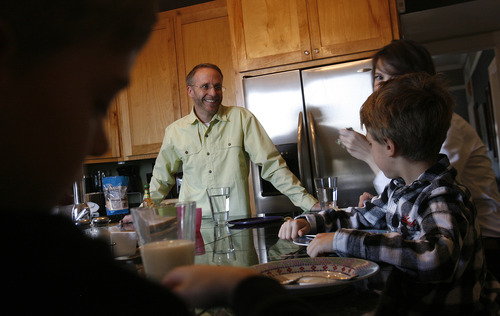 Scott Sommerdorf   |  The Salt Lake Tribune
Paul Lee talks with his 7 year old son Finn, right, as the family prepares dinner together, Friday, April 12, 2013. Lee has been stepfather to 16-year-old Izzy Peterson since she was 5. Paul is married to Merrie Campbell-Lee and they have two young sons, Sullivan 9, and Finn 7, together.