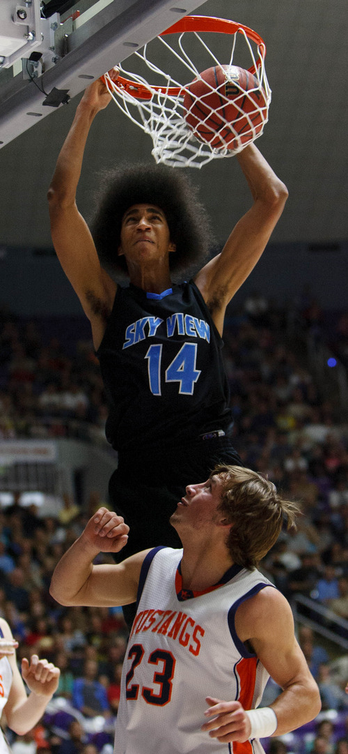 Trent Nelson  |  The Salt Lake Tribune
Sky View's Jalen Moore dunks over Mountain Crest's Gaje Fergusen as Mountain Crest faces Sky View High School in the 4A basketball state championship game Saturday, March 2, 2013 in Ogden.