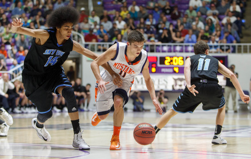 Trent Nelson  |  The Salt Lake Tribune
Mountain Crest's Tyler Crosbie dribbles between Sky View's Jalen Moore and Braxton Godderidge as Sky View beats Mountain Crest High School in the 4A basketball state championship game Saturday, March 2, 2013 in Ogden.