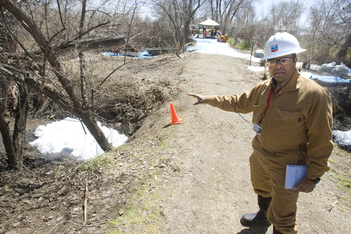 Paul Fraughton  |  The Salt Lake Tribune
Patrick Green, incident commander for the March 18 Chevron pipeline spill at Willard Bay State Park, on Wednesday points out the use of pompoms, (a material that collects petroleum distillates) in a small stream that was affected by the diesel fuel spill.