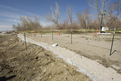 Paul Fraughton  |  The Salt Lake Tribune
A French drain behind a small berm near a beaver pond at Willard Bay State Park was installed by workers cleaning up the March 18 diesel fuel spill to collect any residual fuel in the groundwater before it reaches the bay.  Wednesday, April 10, 2013