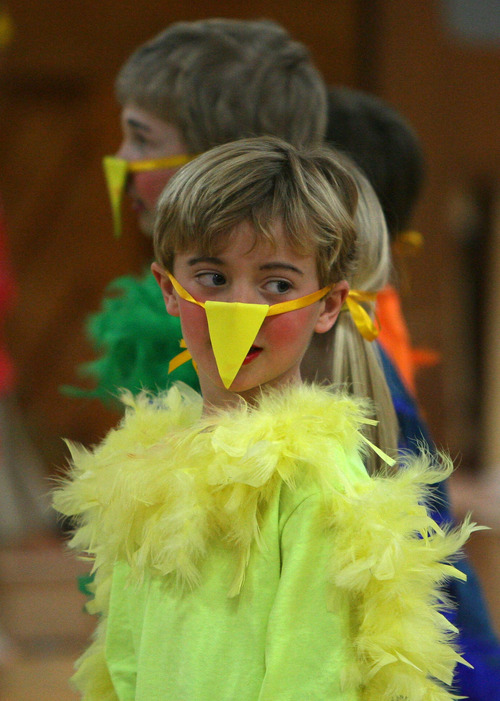 Steve Griffin  |  The Salt Lake Tribune
St. Vincent de Paul Catholic School kindergartener James Anderson plays a bird in the opera "Rose's Garden" during a dress rehearsal at the Holladay school.