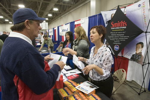 Paul Fraughton  |  The Salt Lake Tribune
Tonya Gonzales of Smith's Food and Drug Stores talks with David Dobbs about available jobs at different stores in the area. Hundreds of former and active military men and women met with potential employers at the 2013 Hiring Our Heros Job Fair held at the Salt Palace Convention Center in conjunction with the Governor's Military and Family Summit on Wednesday, April 17, 2013.                                                     
 Wednesday, April 17, 2013