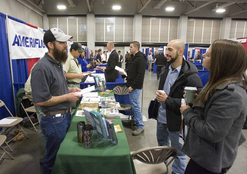 Paul Fraughton  |  The Salt Lake Tribune
Mahmoud Awada, right, and his girlfriend Nikki Brown get information about seasonal firefighting jobs with the US Forest Service from Roy Fetzer at the 2013 Hiring Our Heros Job Fair held at the Salt Palace Convention Center in conjunction with the Governor's Military and Family Summit.                             Wednesday, April 17, 2013
