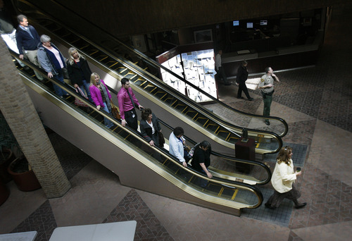 Scott Sommerdorf   |  The Salt Lake Tribune
Workers and others head down the escalators on their way to evacuate the Salt Lake County North Government building during the course of the "Great American Shakeout" earthquake drill, Wednesday, April 17, 2013.