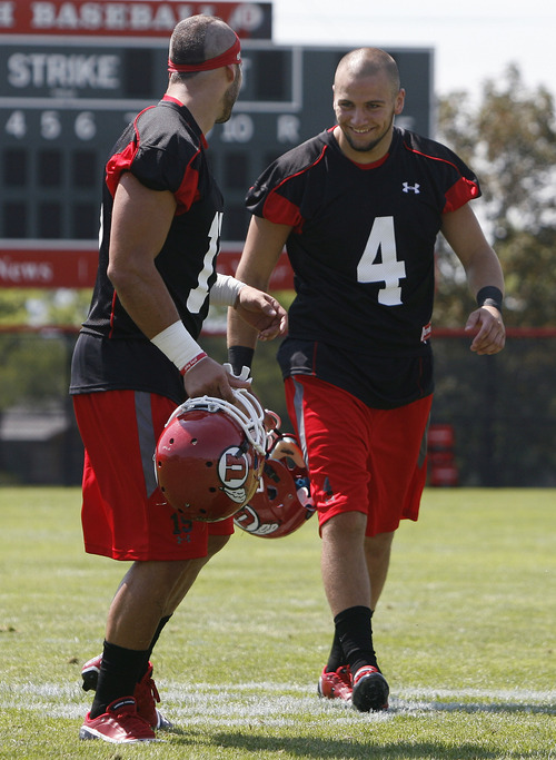 Scott Sommerdorf  |  The Salt Lake Tribune             
Utah safety Brian Blechen, right, jokes with safety Quade Chappuis (No. 19) as he comes off the field and just before he answered questions about his suspension. Opening day of Utah football training camp, Thursday, August 2, 2012.