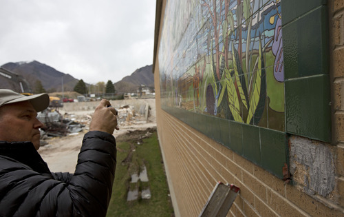 Lennie Mahler  |  The Salt Lake Tribune
Richard Bullough photographs part of a 26-foot by 9-foot tile painting created by his sisters, Patricia Bullough and Rebecca Bullough-Horne, while Patricia taught at the school in the 1990s. The painting, which has served as a memorial for the family after Rebecca passed in 1998, is being demolished now that the new Olympus High is open.