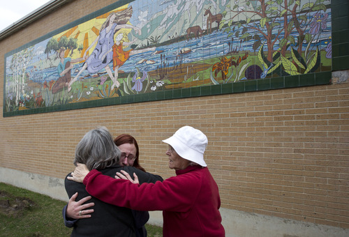 Lennie Mahler  |  The Salt Lake Tribune
Patricia Bullough, her niece, Antonia Horne, and mother, Dee Bullough, embrace in front of a 26-foot by 9-foot tile painting at the old Olympus High School created by Patricia and her late sister, Rebecca Bullough-Horne, while Patricia taught at the high school in the 1990s. The painting, which has served as a memorial to the family since Rebecca passed in 1998, is being demolished now that the new Olympus High is open.