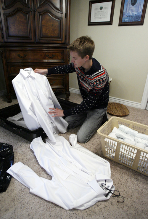 Francisco Kjolseth  |  The Salt Lake Tribune
Brennan Rasmussen, 18, of Provo packs his things on Tuesday, April 9, 2013, as he gets ready to leave for the MTC on Wednesday and then off to Baltimore for his mission. Rasmussen graduated from Timpview High early in order to go on his mission when he turned 18.