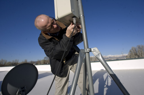 Kim Raff  |  The Salt Lake Tribune
Physician Duane Harris installs a new Roto-Rod, a device that collects daily pollen samples, on the roof of Intermountain Allergy and Asthma in Draper on April 18, 2013. These samples are used to determine Utah's pollen count.