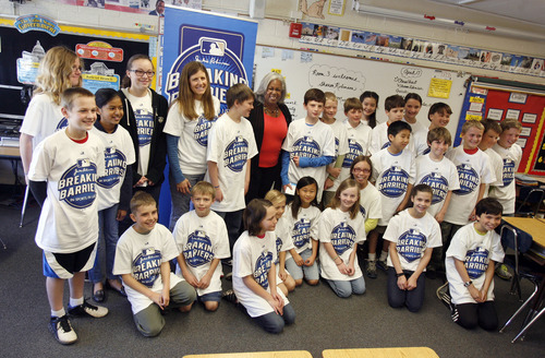 Francisco Kjolseth  |  The Salt Lake Tribune
Sharon Robinson, center, Jackie Robinson's daughter, is surrounded by Lynda Davis' 5th grade class at Morningside Elementary on Wednesday, April 17, 2013, during a special visit. Robinson, Educational Programming Consultant for Major League Baseball and author of the new children's book, Jackie Robinson: American Hero, visited the Breaking Barriers: In Sports, In Life Essay Contest First Prize winner, Steven Blodgett, 11, just right of Robinson, at his school. Steven, whose essay recounts the courage it took to fight bone cancer, got the opportunity to meet Robinson and hear her speak about her father, late Hall of Famer Jackie Robinson.