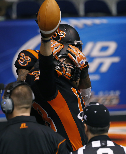Scott Sommerdorf   |  The Salt Lake Tribune
Blaze WR Chase Deader celebrates his TD during first half play. The Blaze were down 33-28 at the half in their Arena League home opener against the Arizona Rattlers, Friday, March 29, 2013.
