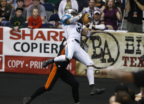 Scott Sommerdorf   |  The Salt Lake Tribune
Rattlers WR Jared Perry scores a first half TD against the Blaze. The Blaze were down 33-28 at the half in their Arena League home opener against the Arizona Rattlers, Friday, March 29, 2013.