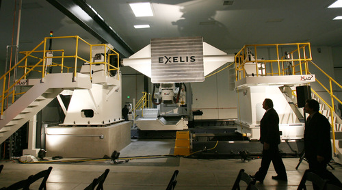 Steve Griffin | The Salt Lake Tribune


Visitors get a close look at an automated fiber placement machine at Exelis, a manufacturing company that makes composite materials for airframes for commercial and military aircraft, during opening of their new composite design and manufacturing center at 5995 west Amelia Earhart Drive in Salt Lake City, Utah Thursday August 16, 2012.