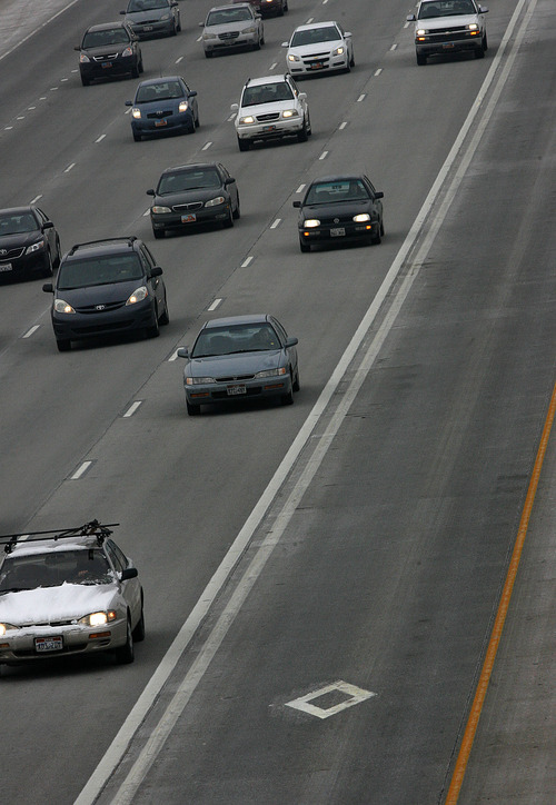 Scott Sommerdorf  l  Tribune file photo
Traffic southbound on I-15 near 4500 South. A program launched in 2010 to allow solo drivers to buy their way into express lanes is costing more than its bringing in in revenue. Highway officials are considering a monthly fee.