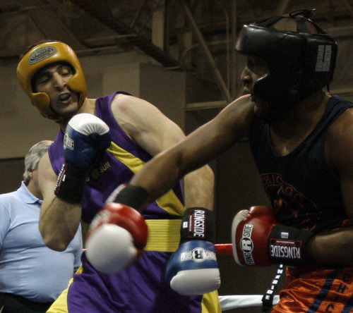 Boston bomb suspect Tamerlan Tsarnaev (in purple) fights Lamar Fenner (in orange) in this archive photo from the 201 weight class in the 2009 Golden Gloves National Boxing Tournament at the Salt Palace, Monday, May 4,  2009. Rick Egan/The Salt Lake Tribune