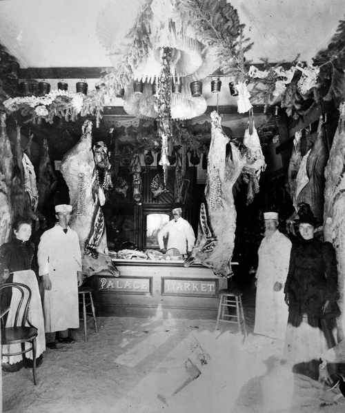 (Salt Lake Tribune archive)
The Palace market in the 1890s. It was half a block west of Main on Center St., in Logan. A custom at Christmas was to use cranberries to spell greetings on the side of a hog.